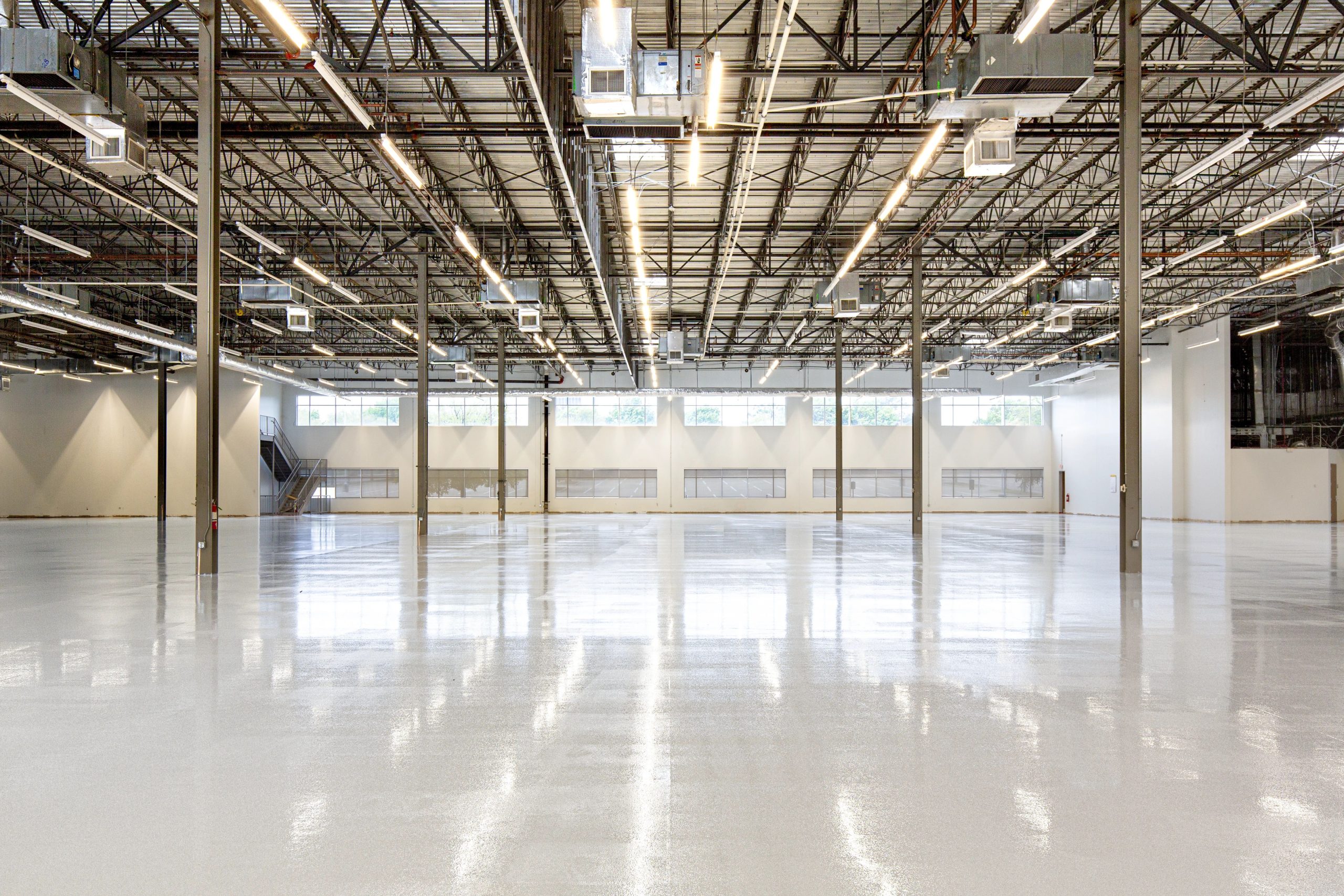 Empty industrial warehouse interior with a polished concrete floor