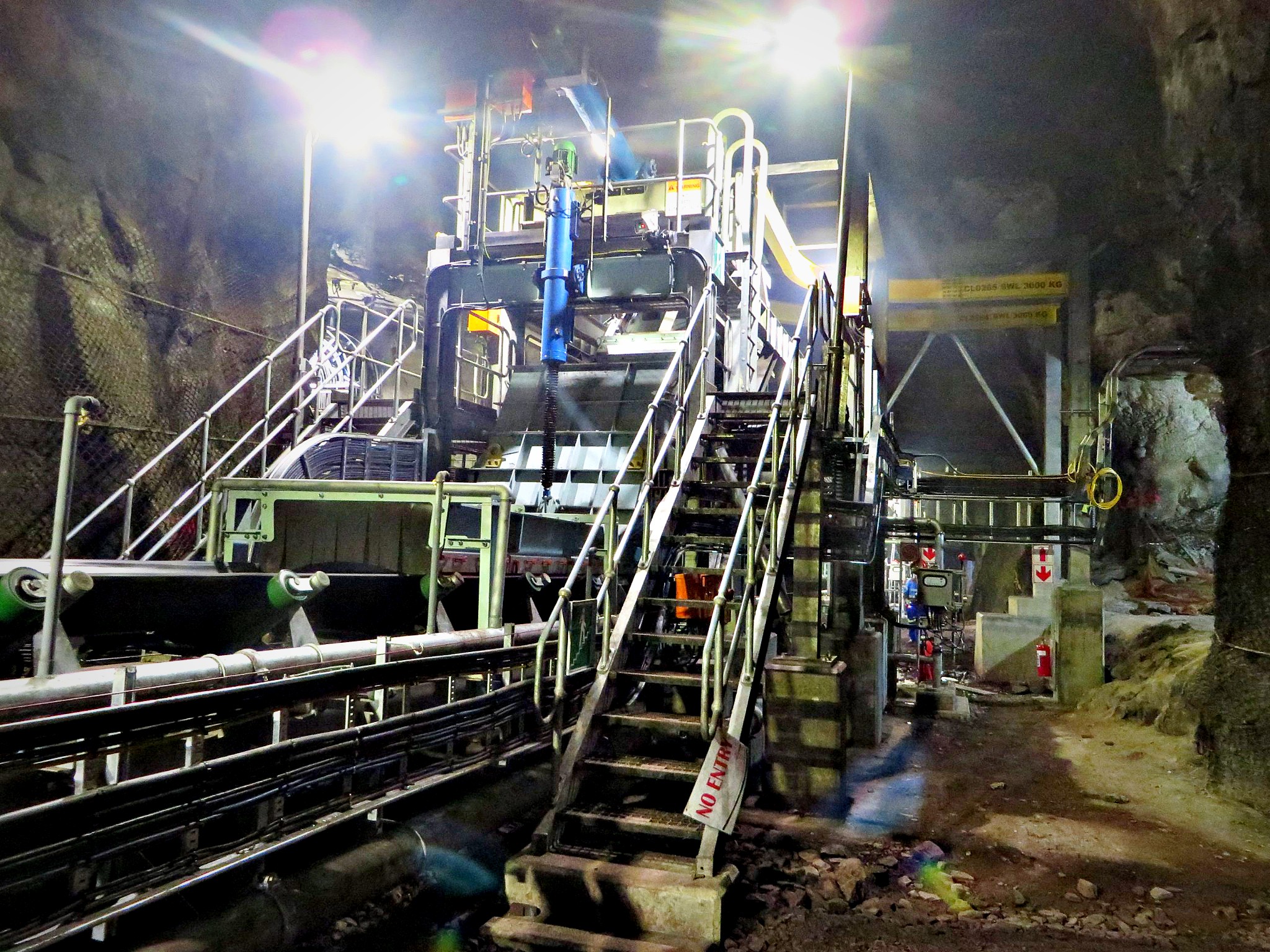 Conveyor and steel walkway structure at a mining infrastructure site
